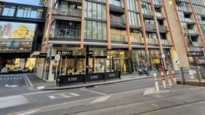 A modern high-rise building with multiple balconies and large windows. - All on Flinders (Melbourne)