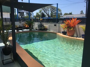 Outdoor pool, open 9:00 AM to 8:00 PM, pool loungers
