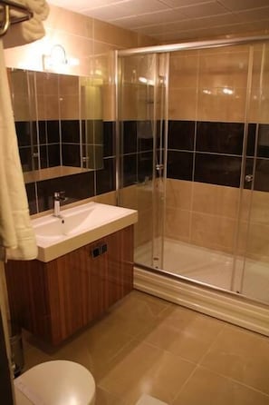 Shower, free toiletries, hair dryer, slippers