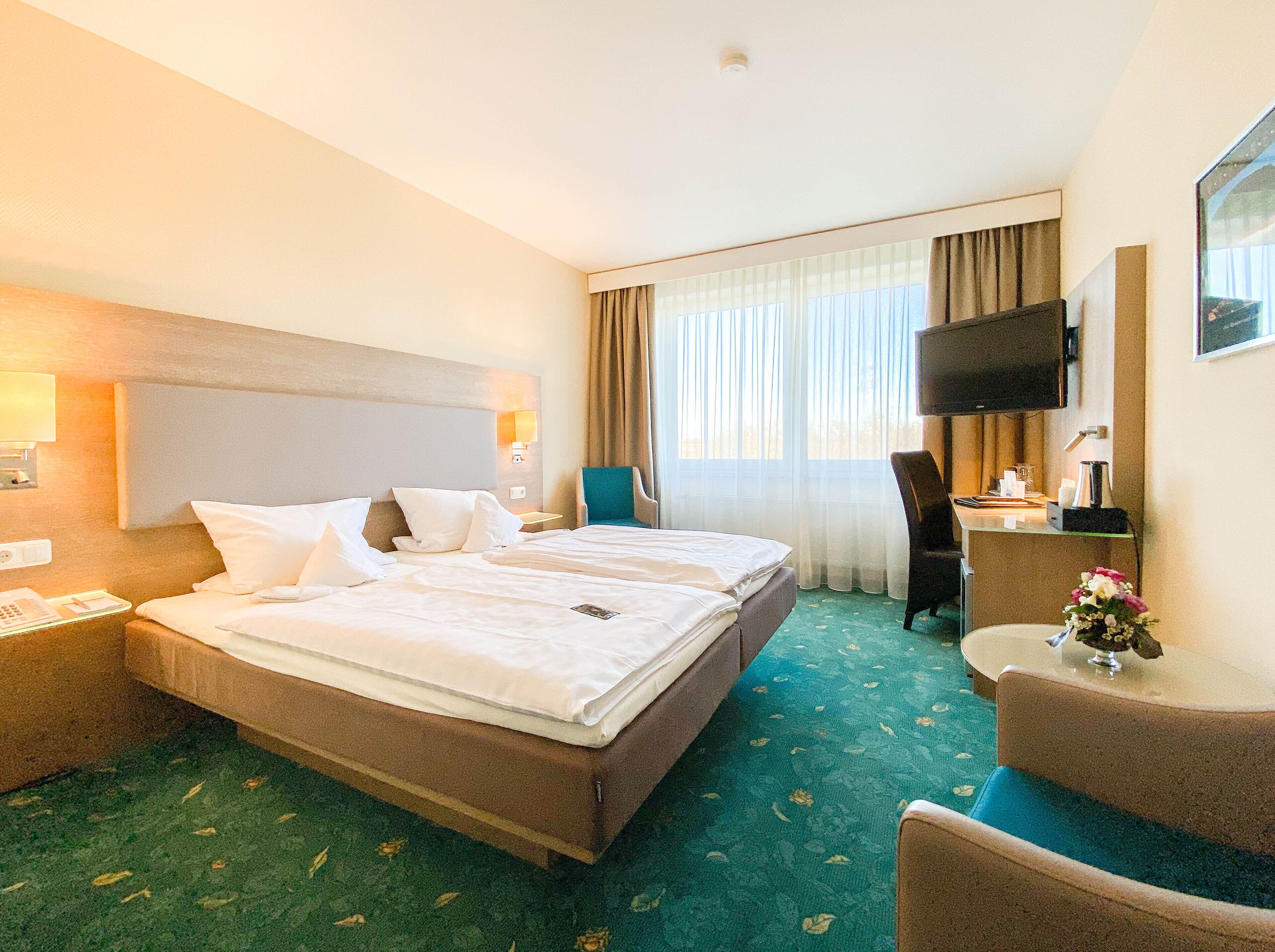 Comfort Double Room Single Use | Living area | Flat-screen TV