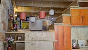 Studio Suite, 1 Bedroom, Kitchenette | Living area | 32-inch LED TV with digital channels, TV