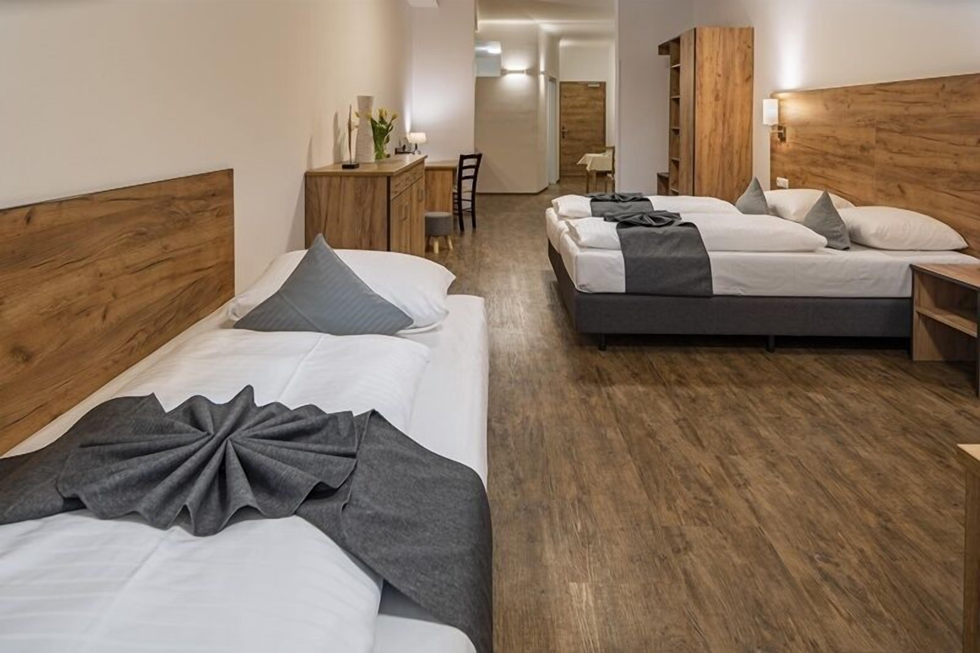 Family Room | Premium bedding, desk, laptop workspace, blackout curtains