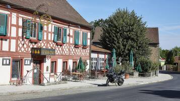 A traditional half-timbered building with a sign for 'BENDRICH'.
