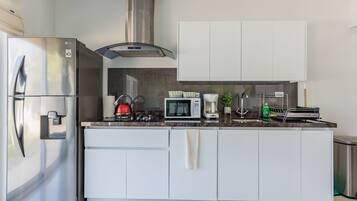 Koyari Modern Condos Appt # 2 | Private kitchen | Fridge, microwave, oven, stovetop