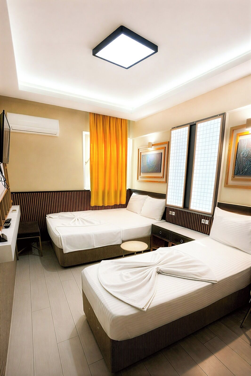 Standard Triple Room | Minibar, in-room safe, desk, laptop workspace