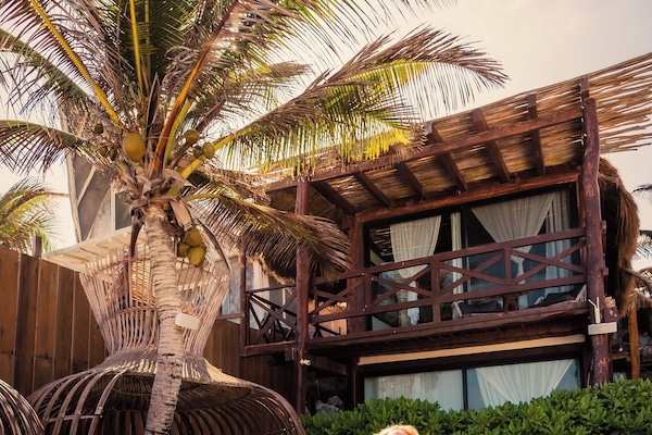 On the beach, white sand, free beach cabanas, sun loungers