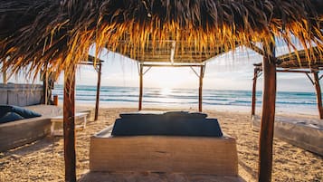 On the beach, white sand, free beach cabanas, sun-loungers