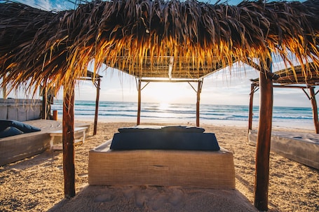 On the beach, white sand, free beach cabanas, sun loungers