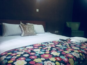 Desk, laptop workspace, bed sheets