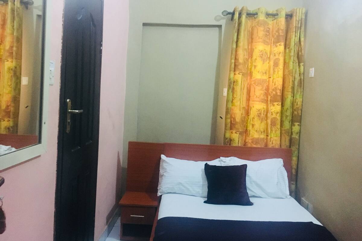 Desk, laptop workspace, bed sheets