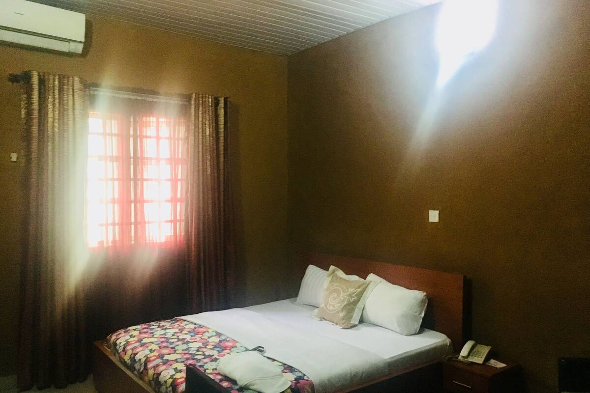 Desk, laptop workspace, bed sheets