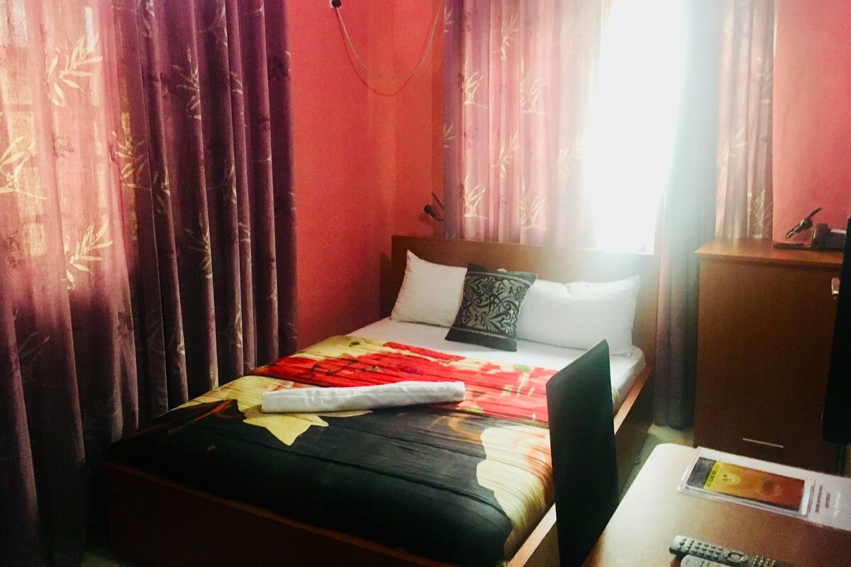 Desk, laptop workspace, bed sheets