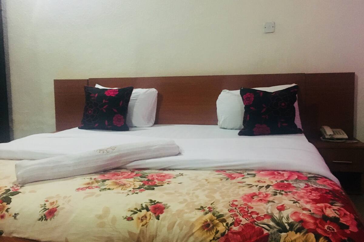 Desk, laptop workspace, bed sheets