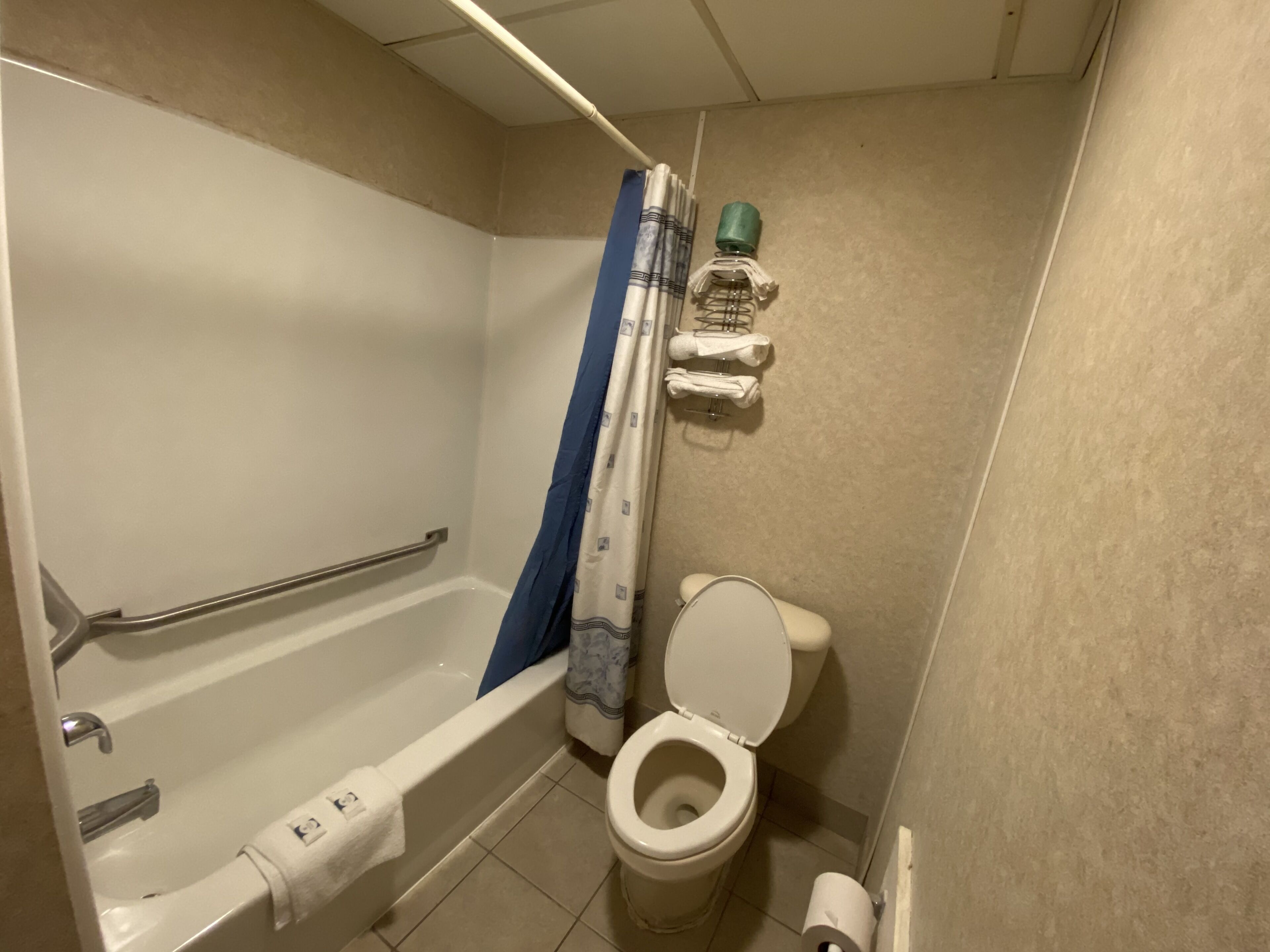 Basic Double Room, 2 Queen Beds | Bathroom | Combined shower/tub, rainfall showerhead, free toiletries, hair dryer