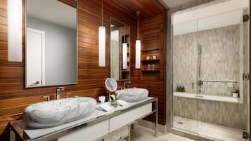 Shower, designer toiletries, hair dryer, bathrobes