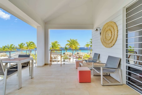 1 King Bed One Bedroom Apartment - Ocean View | Living area | LED TV. Delfins Beach Resort Bonaire, Tapestry Collection by Hilton
