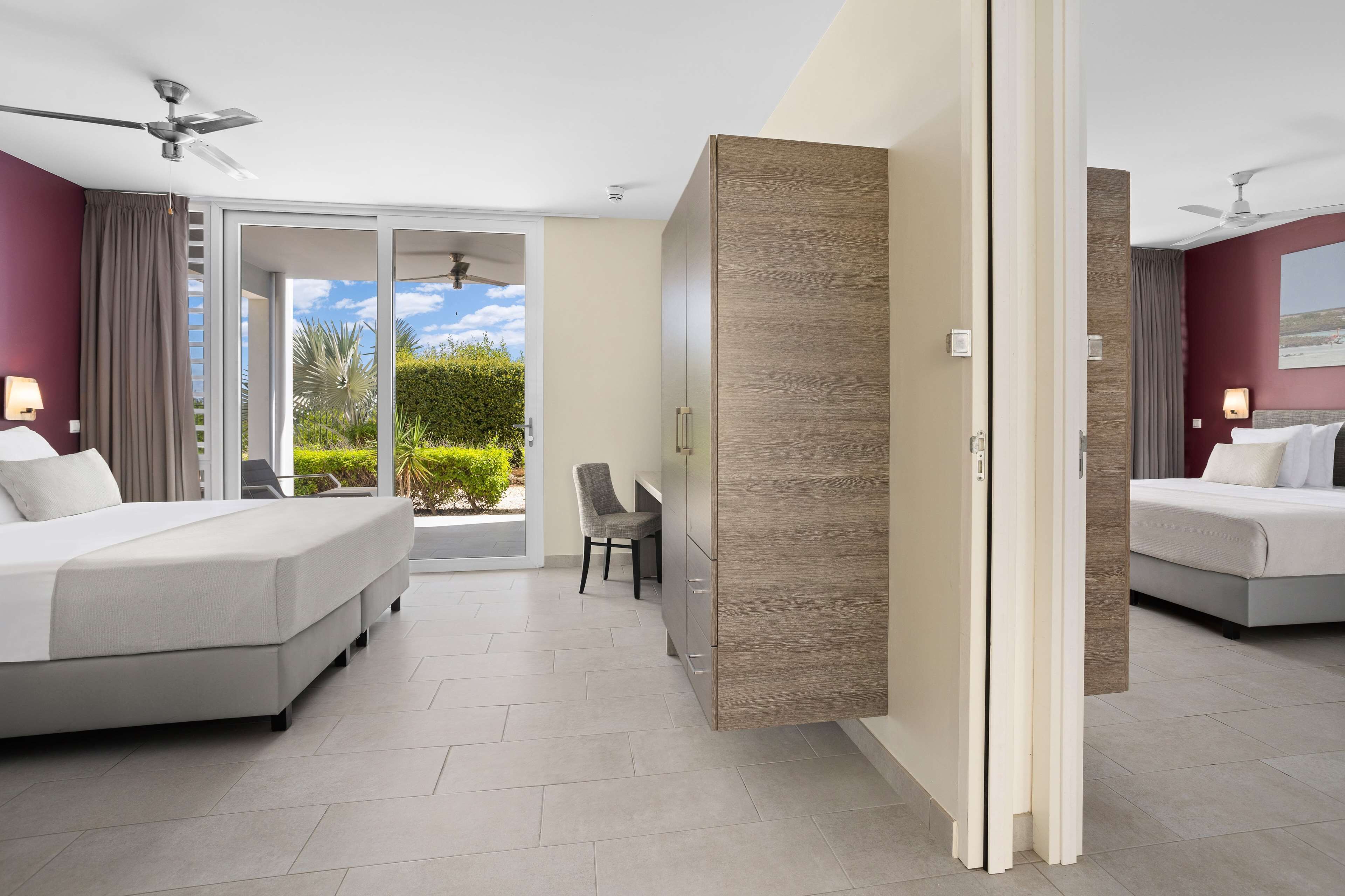 king hilton family room | in-room safe, blackout curtains, iron/ironing board, bed sheets