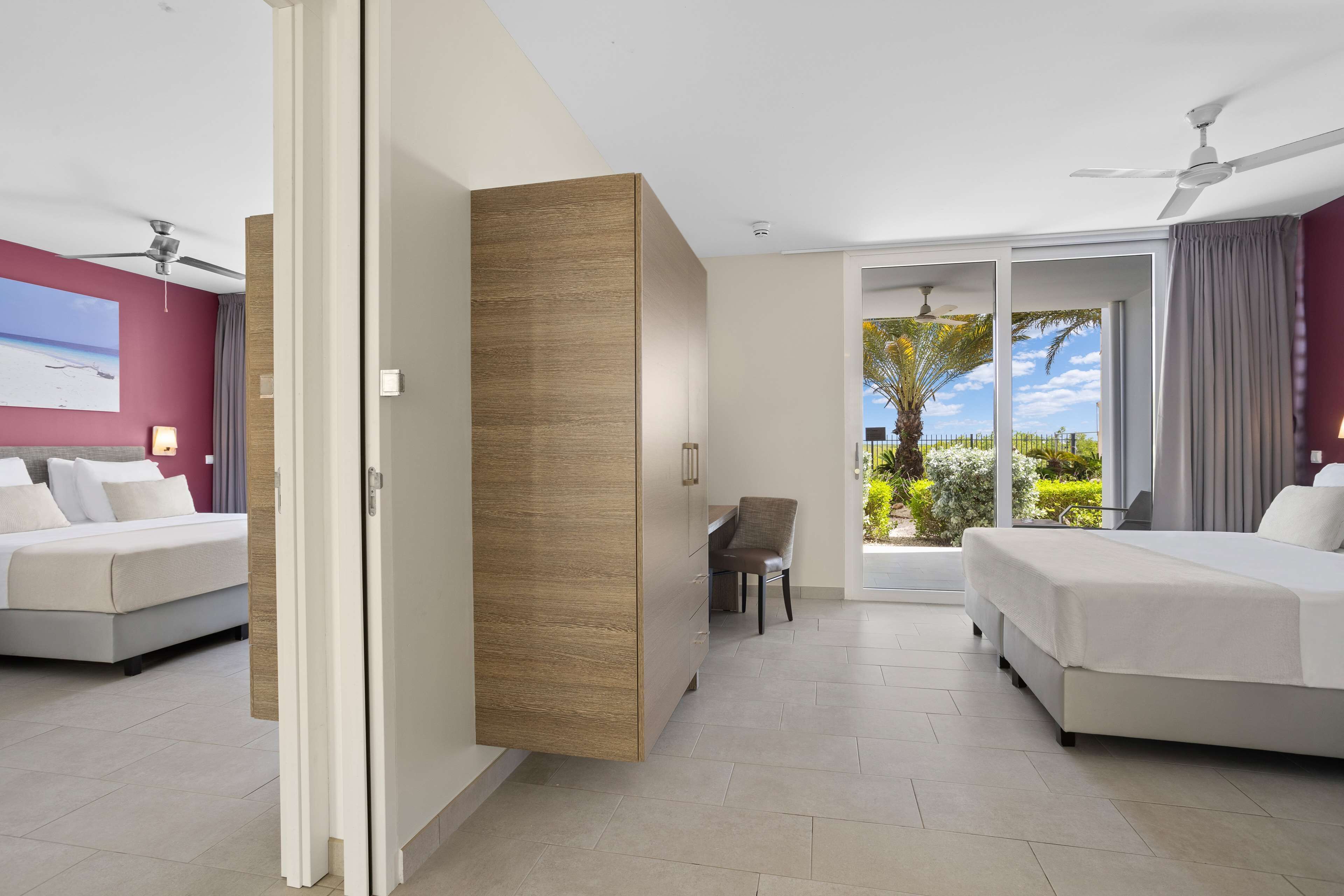 king hilton family room | in-room safe, blackout curtains, iron/ironing board, bed sheets