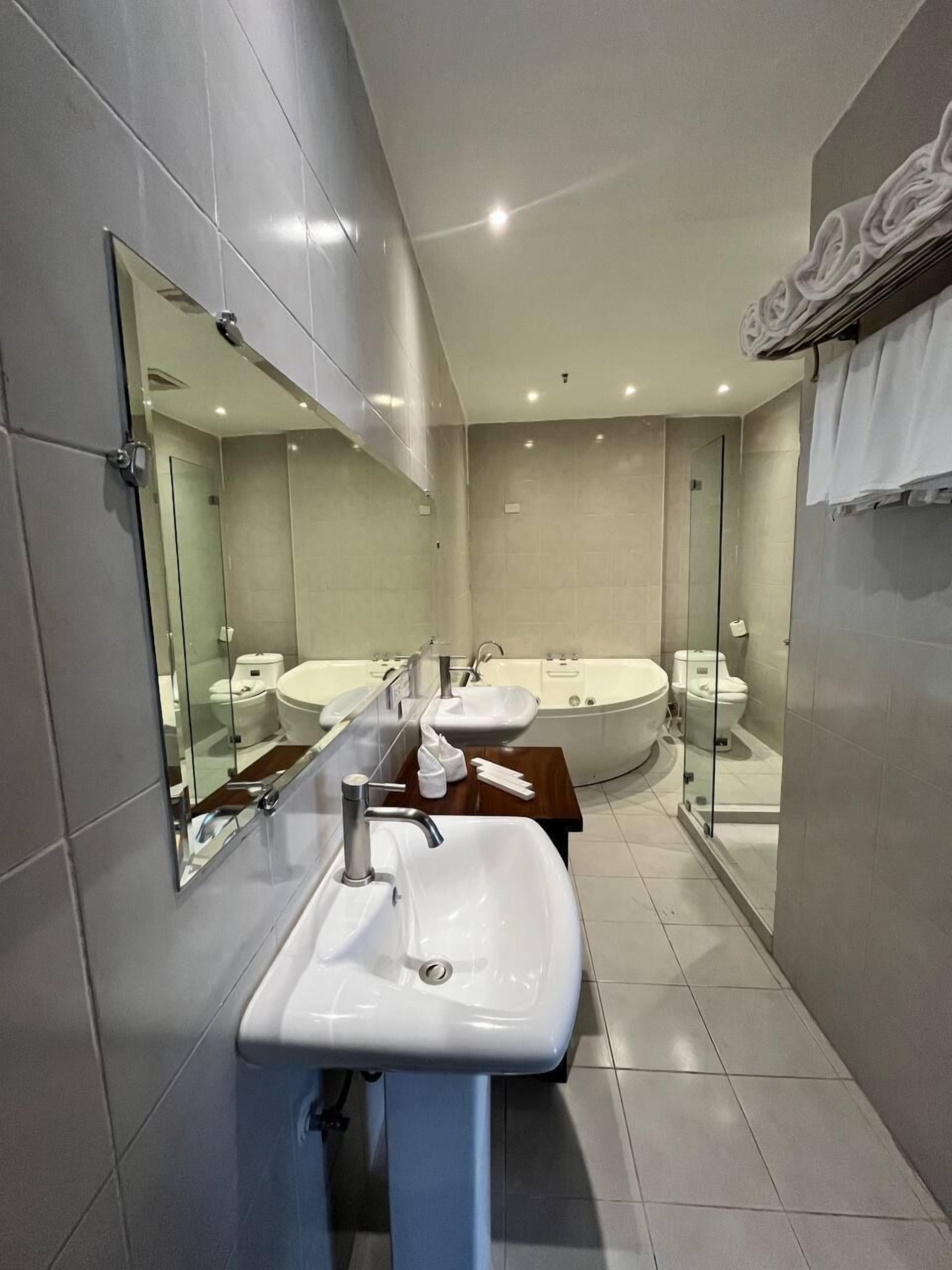 botanical suite with jacuzzi | bathroom | shower, rainfall showerhead, free toiletries, hair dryer