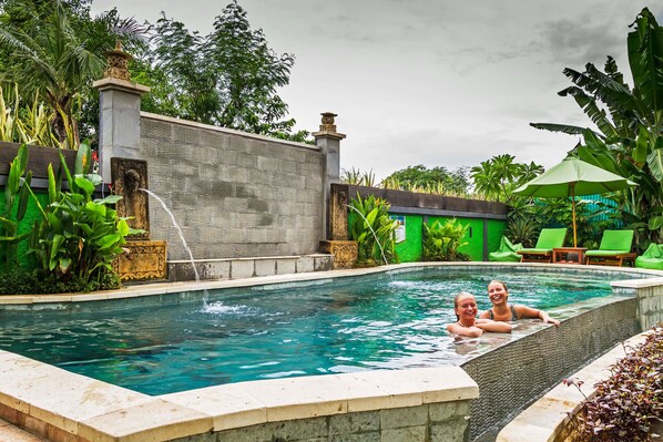 Outdoor pool, open 6 AM to 7 PM, pool loungers