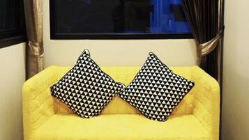 Standard Triple Room | Living area | 32-inch flat-screen TV with digital channels, TV