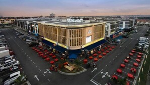 A hotel with a modern design, featuring a prominent sign for 'BEST LION Boutique Hotel'.