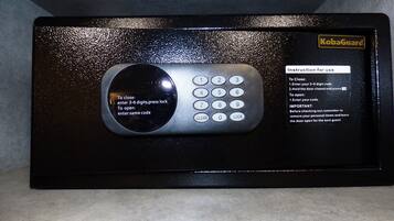 A KobaGuard electronic keypad with instructions for use, including entering a 3-6 digit code to lock or unlock.