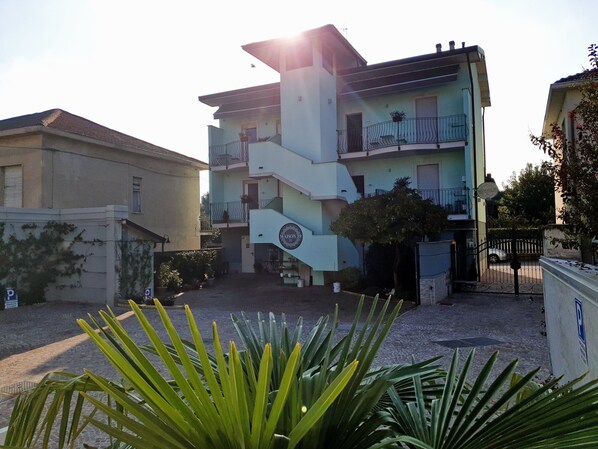 A multi-story building with a staircase leading to the upper floors. -  Gruppo Luxe Domus (Vigevano)