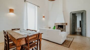Deluxe Suite, 2 Bedrooms | Living area | Flat-screen TV