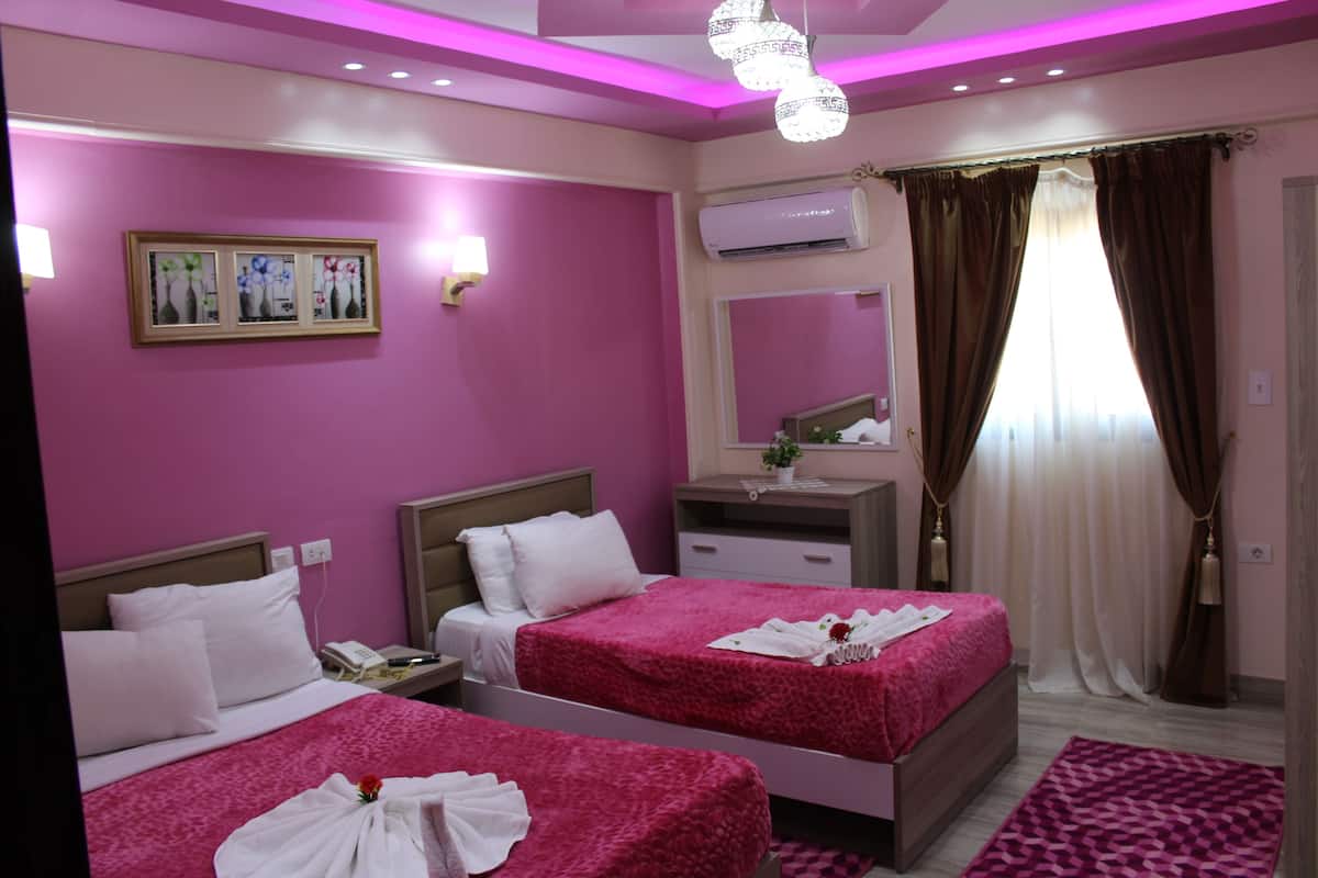 Family Suite, 2 Bedrooms, City View | Egyptian cotton sheets, premium bedding, pillowtop beds, minibar
