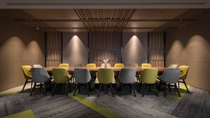 A conference room with a long table, six chairs, and a decorative vase. - Plaza Premium Lounge Terminal 2 Zone A (Taoyuan City)
