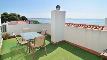 Enjoy a peaceful rooftop dining experience with a stunning sea view.