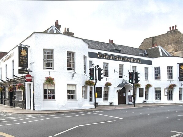 A white building with a sign reading "Ye Olde Griffin Hotel". - Ye Olde Griffin (March)