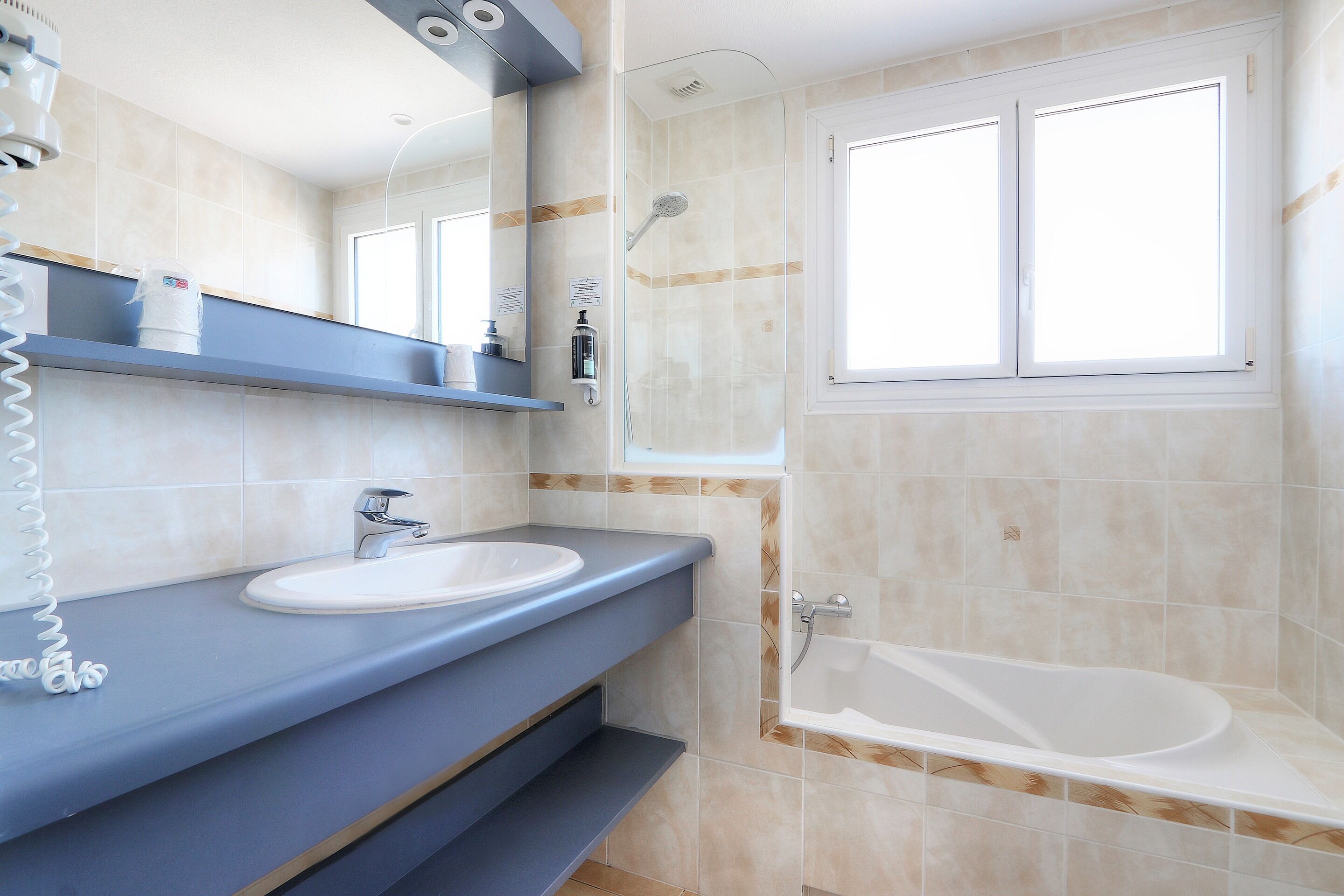 family room, courtyard view | bathroom | towels, soap, shampoo, toilet paper