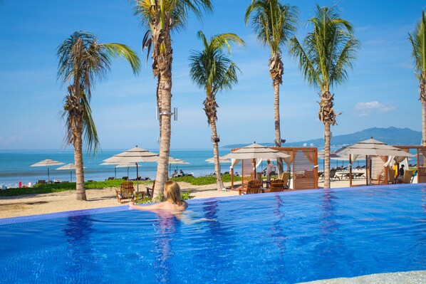 Outdoor pool, pool umbrellas, sun loungers