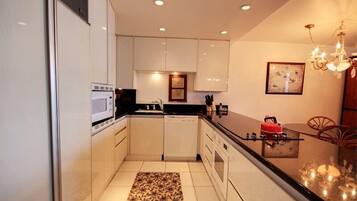 Condo, 1 Bedroom | Private kitchen | Fridge, microwave, oven, dishwasher