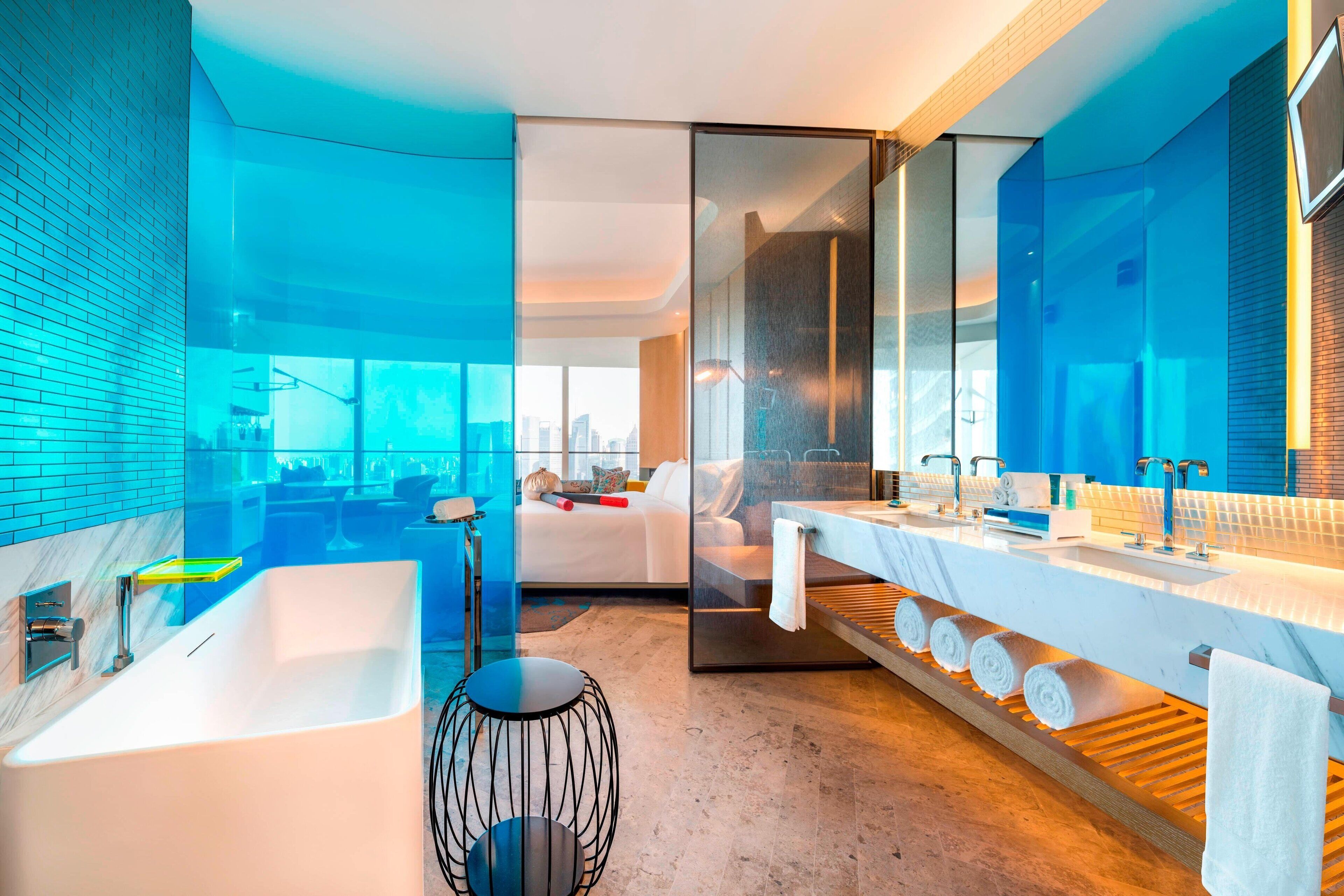 separate bathtub and shower, rainfall showerhead, designer toiletries