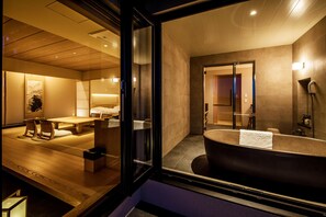Combined shower/bathtub, deep-soaking bathtub, designer toiletries