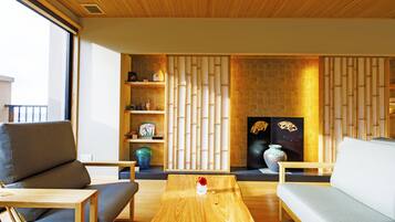 A modern living room with a wooden coffee table, two sofas, and a decorative wall panel.