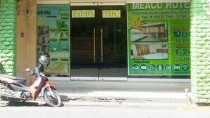 A hotel entrance with a sign reading "MEACO HOTEL" and a motorcycle parked outside. - Meaco Hotel Legazpi (Legazpi)