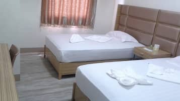 Twin Deluxe Room | Desk, bed sheets