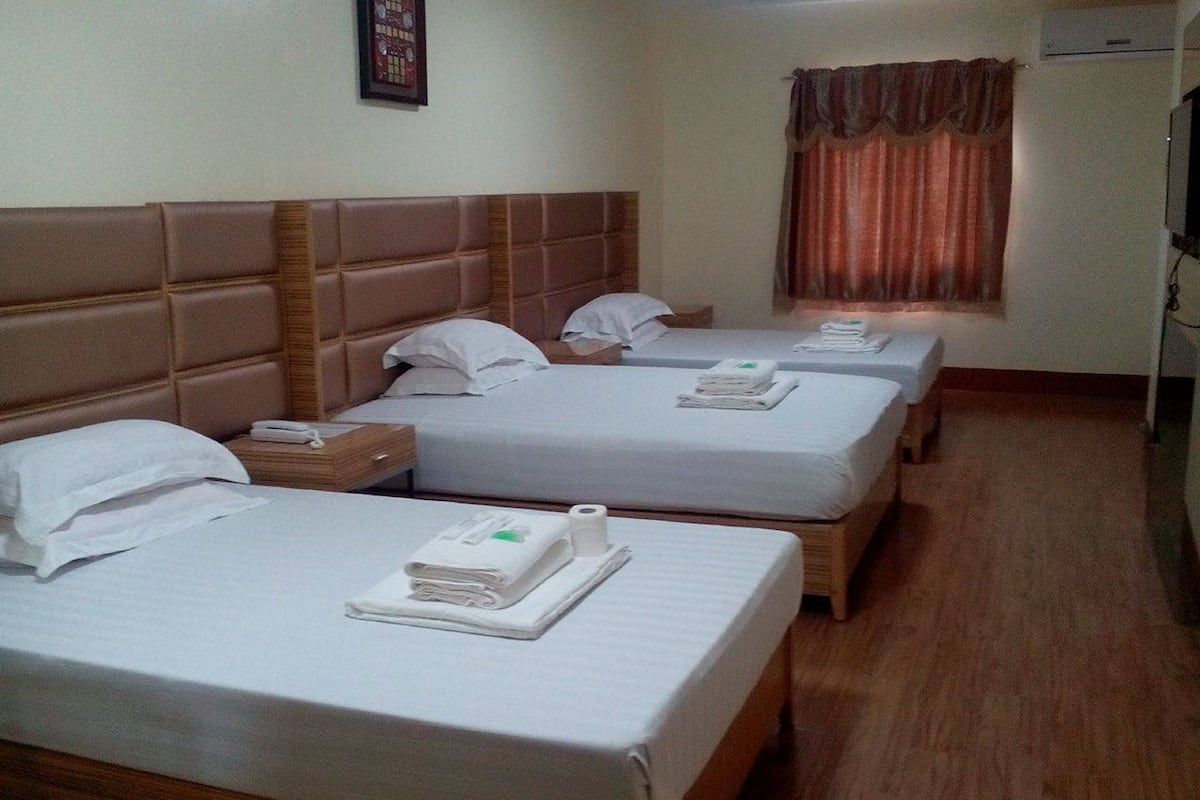 vip family room | desk, bed sheets