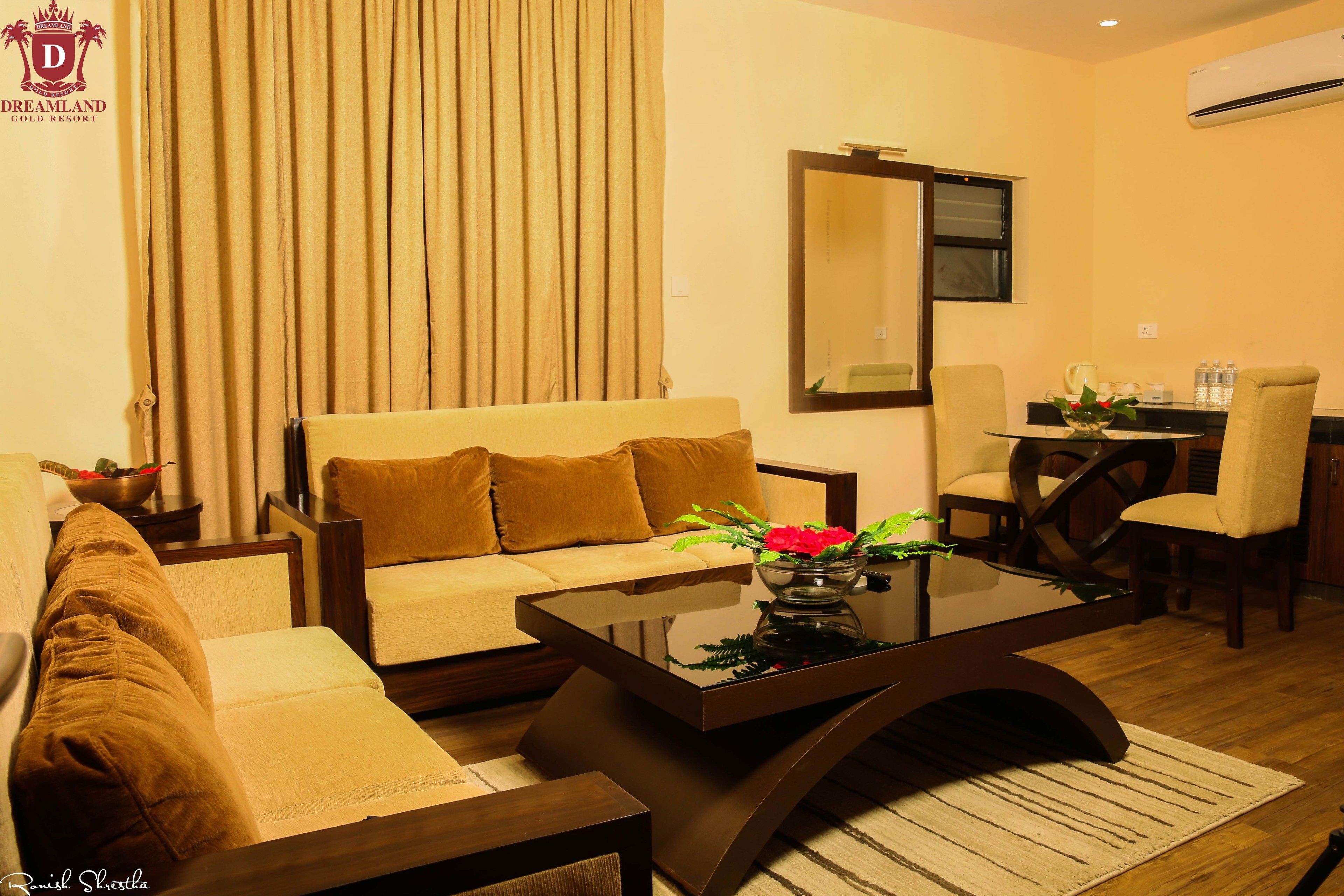 Presidential Studio Suite | Living room | Flat-screen TV