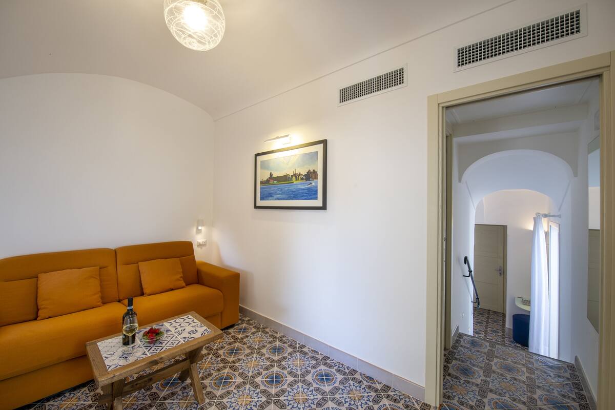 suite with sauna and mini pool with hydromassage | living area | 25-inch lcd tv with satellite channels, tv