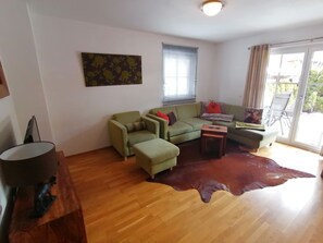 Comfort Apartment, 2 Bedrooms | Living room | 45-inch TV with cable channels