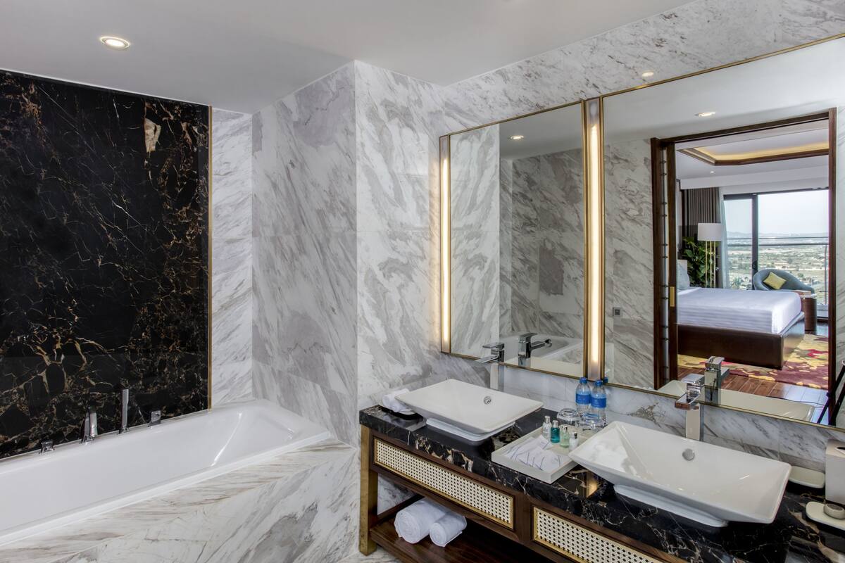 bathtub, designer toiletries, hair dryer, bathrobes