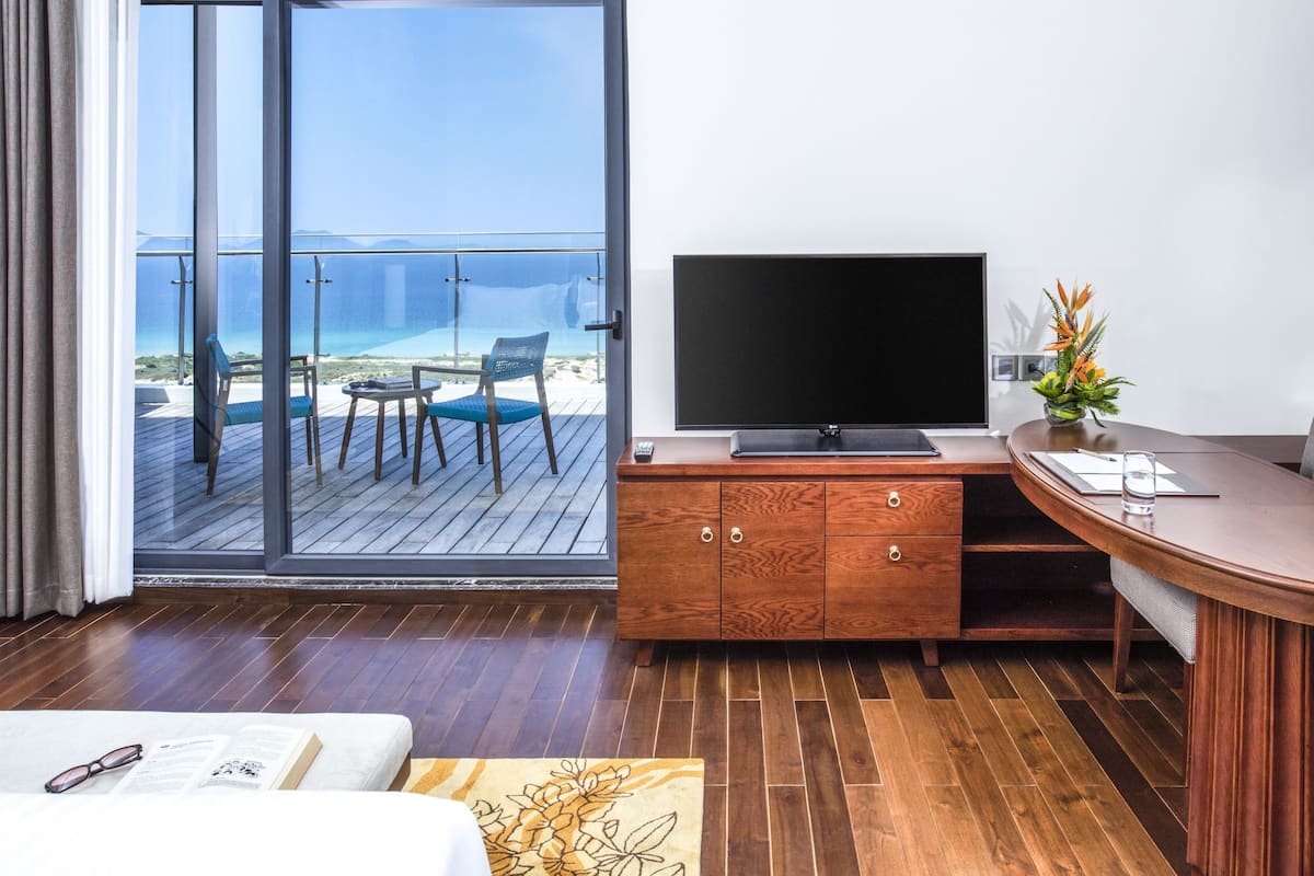 Deluxe Room, Terrace, Sea View | In-room safe, desk, laptop workspace, blackout drapes