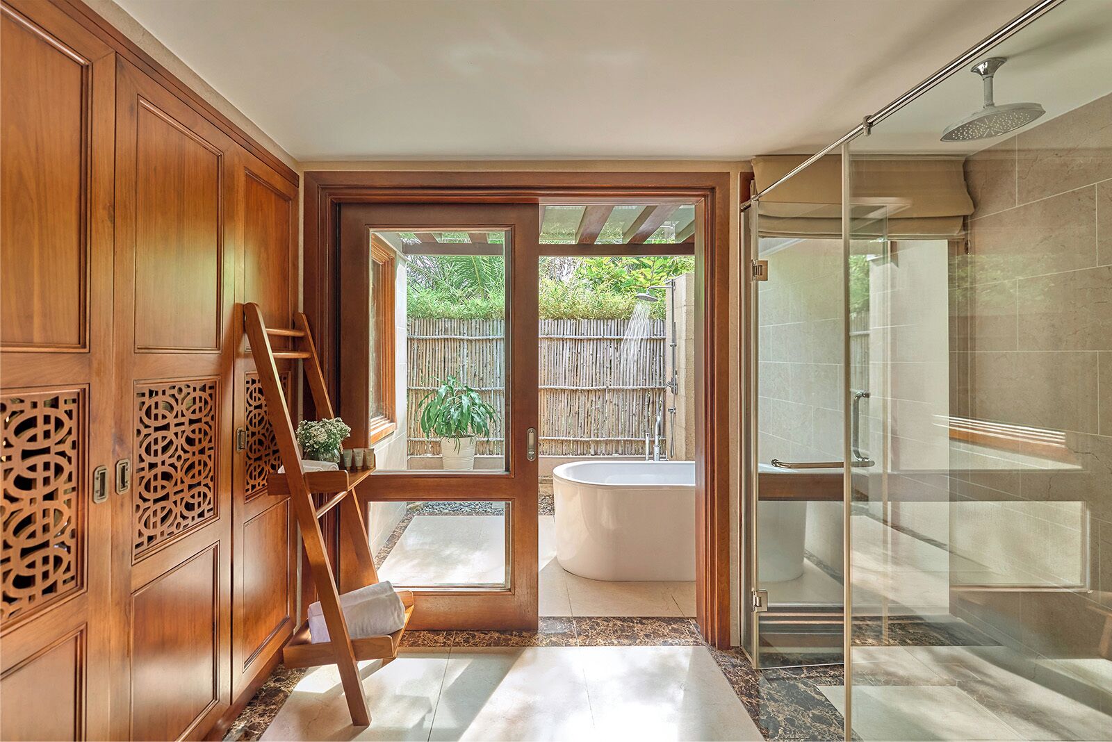 Bathtub, designer toiletries, hair dryer, bathrobes