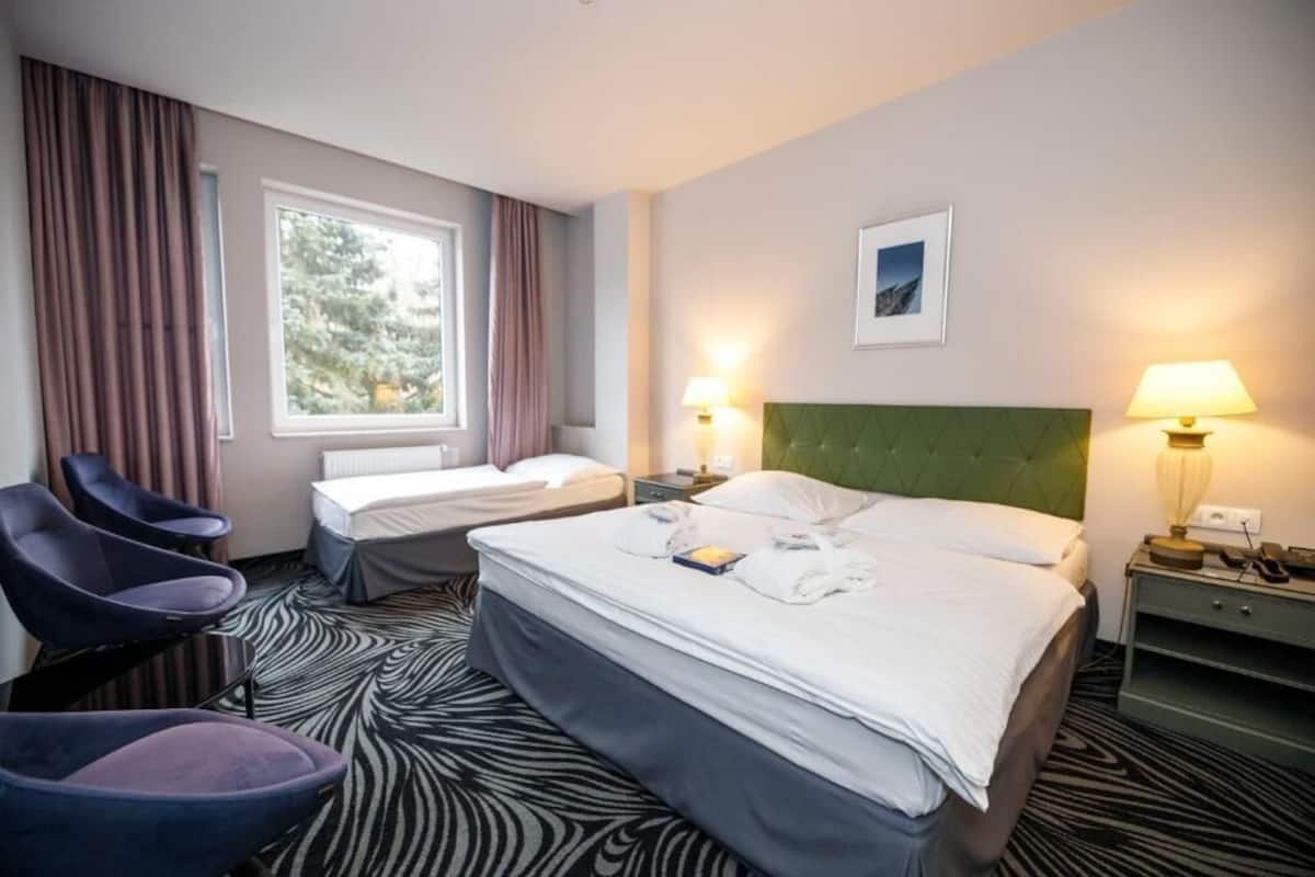 Junior Triple Room, 2 Bedrooms, Accessible, Park View | 1 bedroom, minibar, blackout curtains, soundproofing