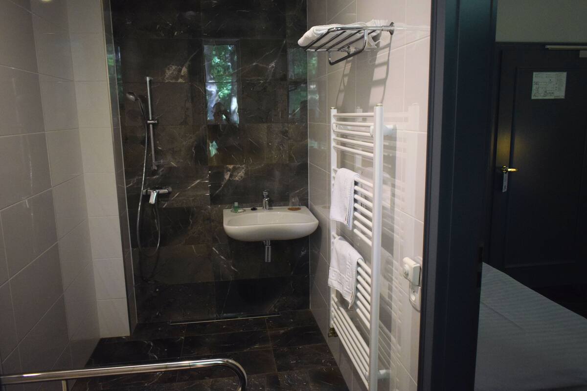 junior triple room, 2 bedrooms, accessible, park view | bathroom | free toiletries, hair dryer, towels, soap